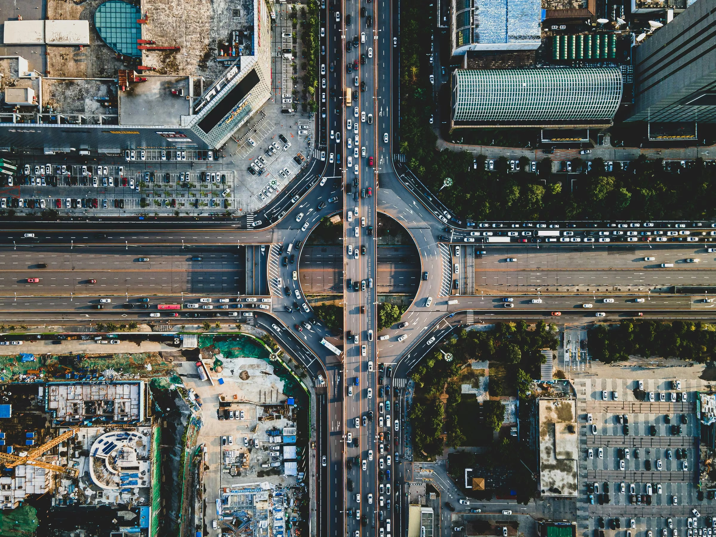 Aerial view of city blocks and an elevated roadway.